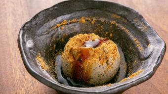 Homemade roasted green tea gelato topped with brown sugar syrup and soybean flour