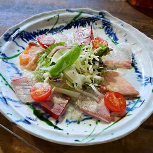 Grilled fresh fish carpaccio-style salad