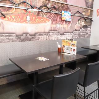 The walls are lined with sofa seats.