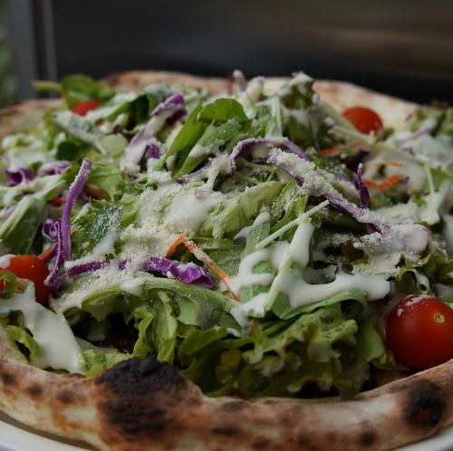 Salad pizza with bagna cauda sauce