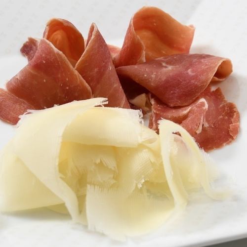 Assorted textured Italian lodigiano cheese and prosciutto