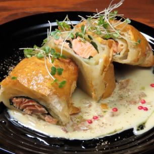 Baked salmon puff pastry with porcini cream sauce