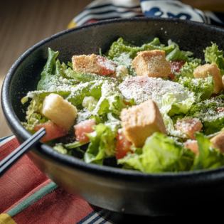 Caesar salad with pinched eggs