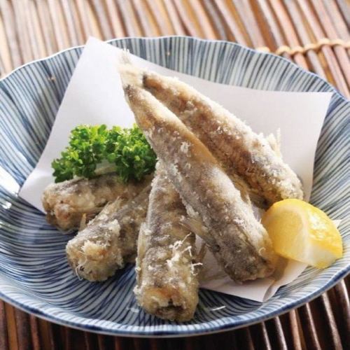 Deep-fried Mehikari, a type of fish caught in the Joban region off the coast of Iwaki City. This fatty white fish is characterized by its fluffy texture.