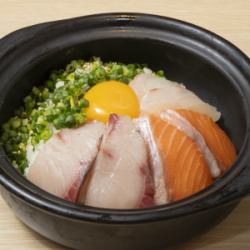 Bowl of rice topped with sashimi
