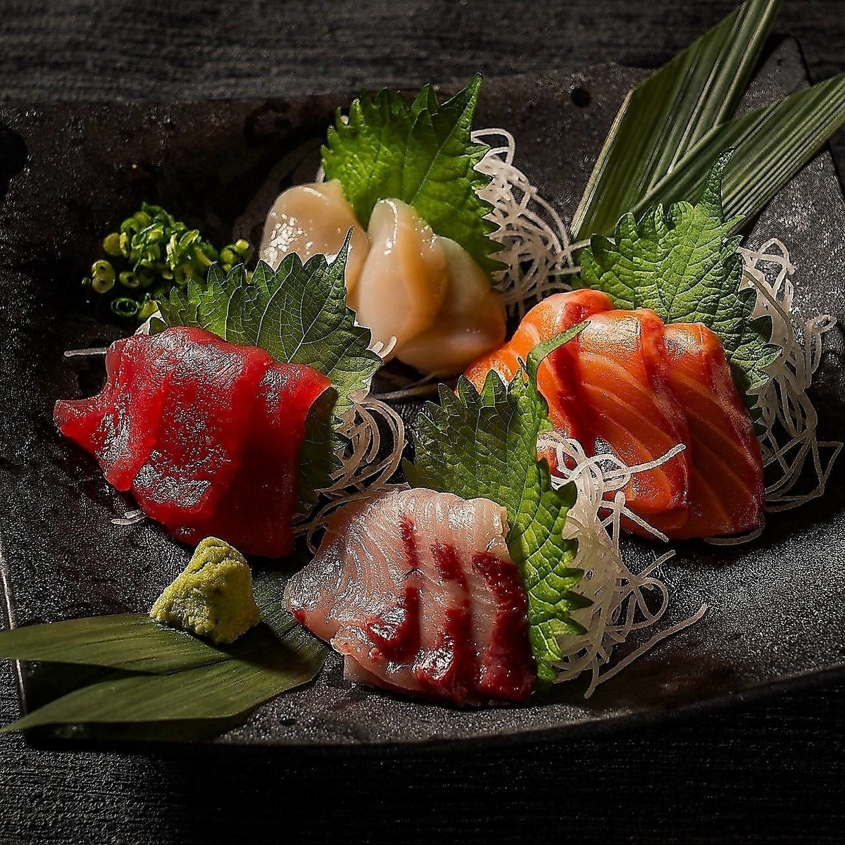 Fresh, seasonal seafood sourced that day is served as sashimi and grilled over a fire.