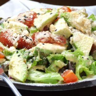 Japanese style Caesar salad with fresh fish and avocado