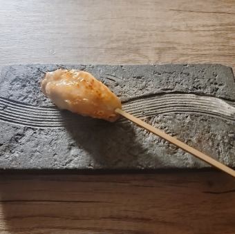 Chicken thigh marinated in kelp and served on a skewer