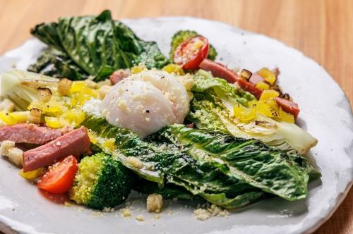 Caesar salad with grilled romaine lettuce and homemade bacon