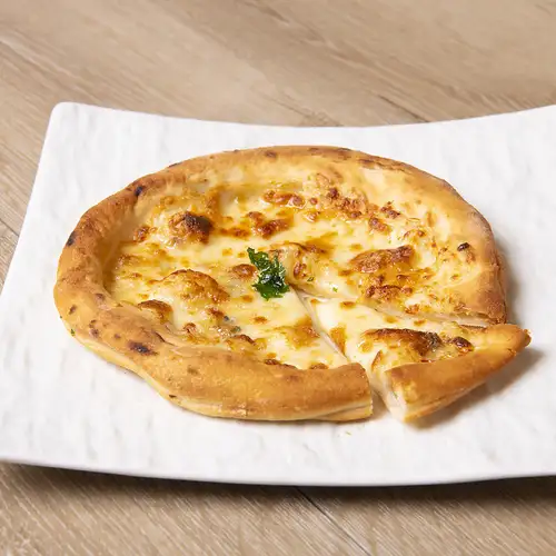 Quattro cheese pizza with honey sauce