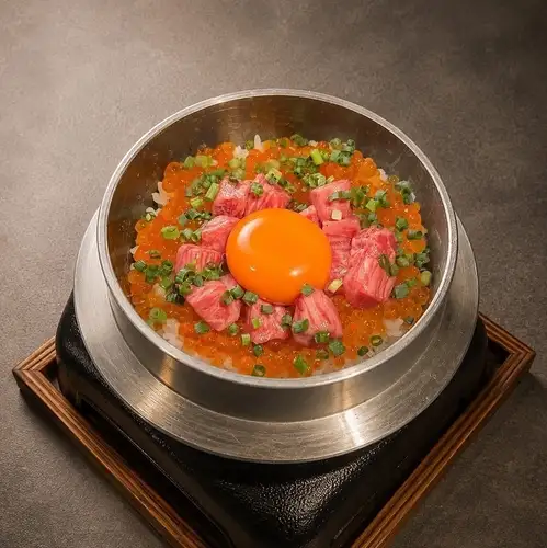Wagyu beef and salmon roe rice cooked in a pot