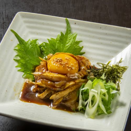 Chicken yukke topped with warm egg
