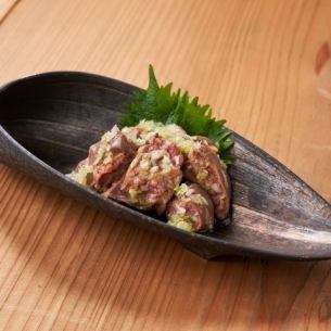 Fatty liver covered in green onions