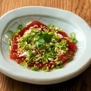 Marinated tuna covered in green onions