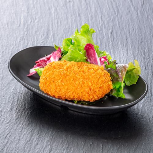 1 crab cream croquette made by a crab shop