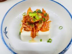 Cold tofu topped with kimchi, yam marinated in tamari soy sauce, bamboo shoots with chili oil