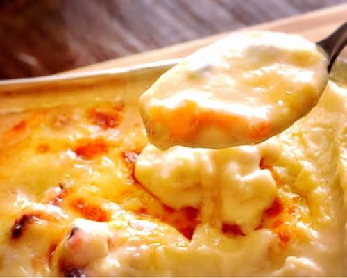 Hot shrimp and rich cheese gratin