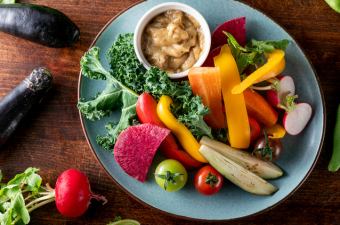 Exquisite sauce Bagna cauda with fresh vegetables