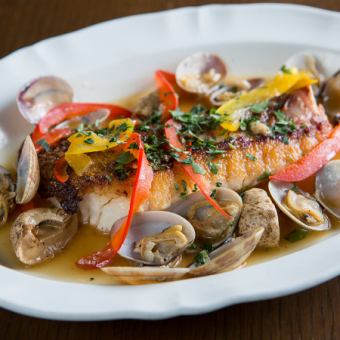 Aqua pazza with white fish and colorful vegetables