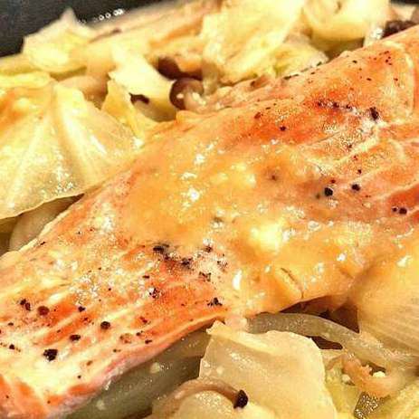 Grilled salmon with miso and cheese on an iron plate