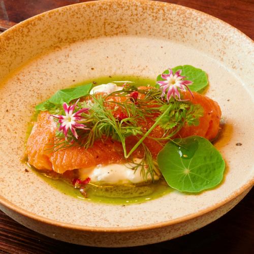 Domestic salmon mi-cuit with basil and green vegetable oil