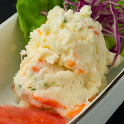 Potato salad with herb pork