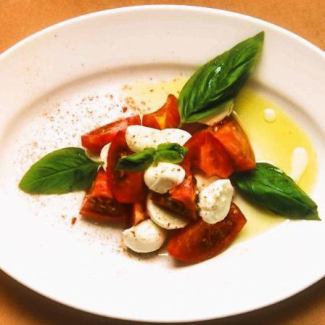 “Caprese” with buffalo mozzarella cheese and cherry tomatoes