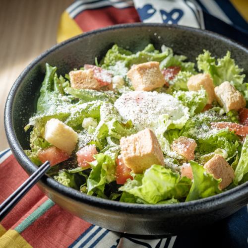 Caesar salad with pinched eggs