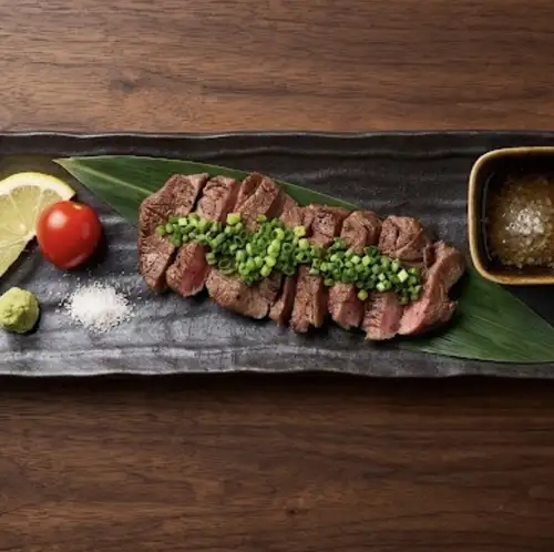 Thick-cut beef tongue grilled over charcoal