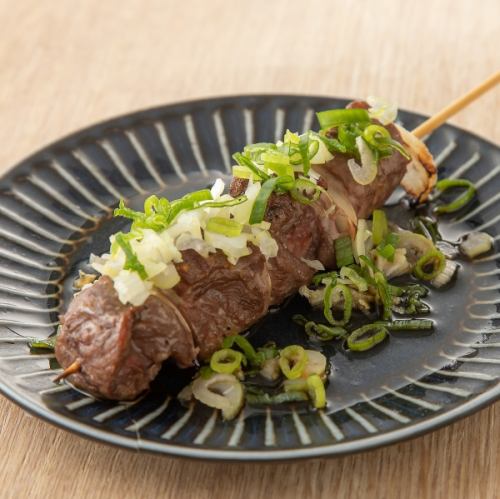 Beef skewers, rare parts, glasses used, lots of green onions, ponzu sauce
