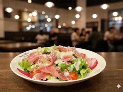 A Caesar salad with fresh vegetables and prosciutto, offering a delightful variety of textures.