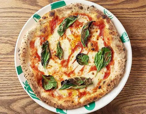 Authentic Neapolitan Margherita pizza with the aroma of oven-baked pizza