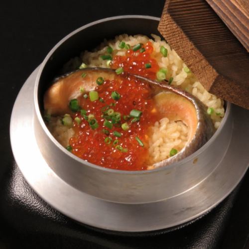 Freshly cooked rice with salmon and salmon roe