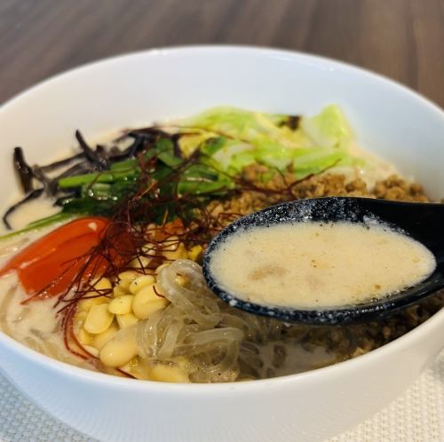 Soy milk vermicelli dandan noodles with tomato chili oil and seasonal vegetables