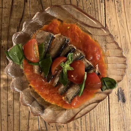 Small plate of marinated sardines, basil and tomatoes