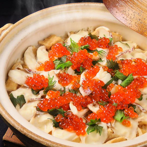 Specially selected seared sea bream in a clay pot topped with salmon roe