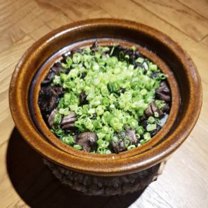 Charcoal-covered chicken cooked in a clay pot