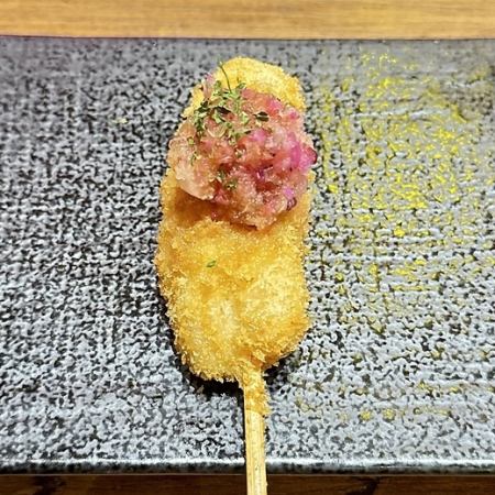 Deep-fried chicken skewers with grated daikon radish and ponzu sauce