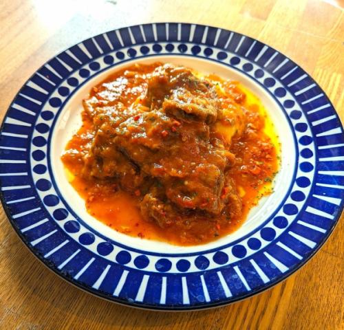 Tuna cheek meat stewed in tomato sauce