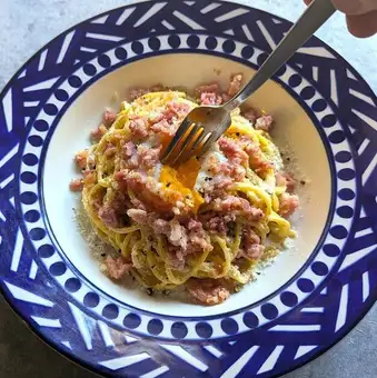 Carbonara with soft-boiled egg and rich cheese