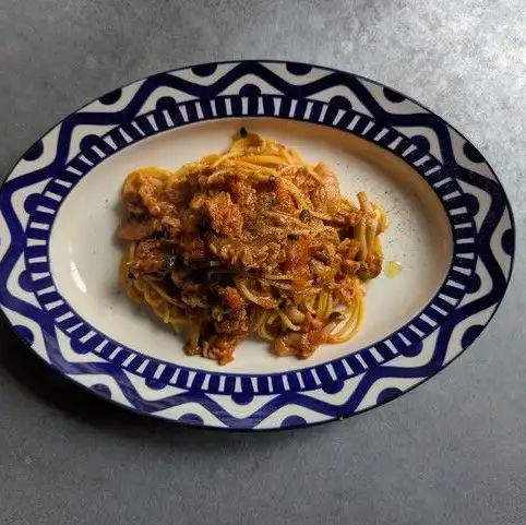 Tomato pasta with chestnut-fed pork, mushrooms, and tuna, lumberjack style.