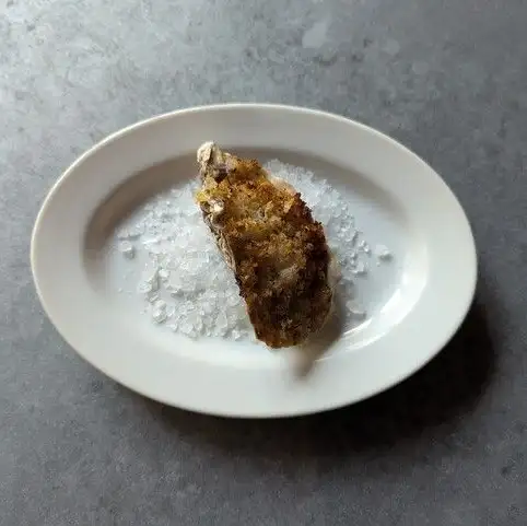Herb-crusted baked oysters in the shell from Ako