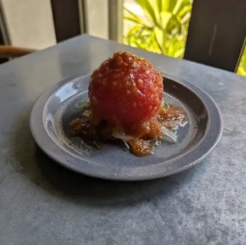 Whole marinated chilled tomatoes