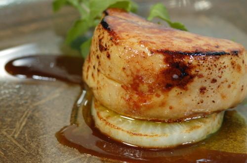 Large foie gras sautéed on an iron plate