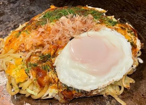 Pork and egg soba with fried egg on top