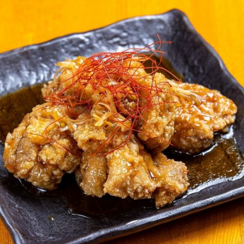 Fried chicken with sweet and sour sauce and fragrant green onion oil