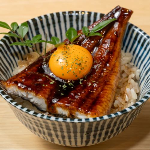 Eel rice bowl with half an eel and egg yolk