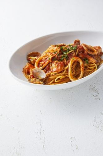 Pescatore with seafood and ripe tomatoes