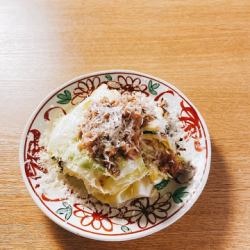 Grilled spring cabbage topped with minced duck breast