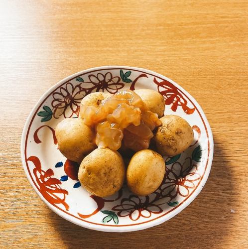 New potatoes with butter and shrimp salted squid